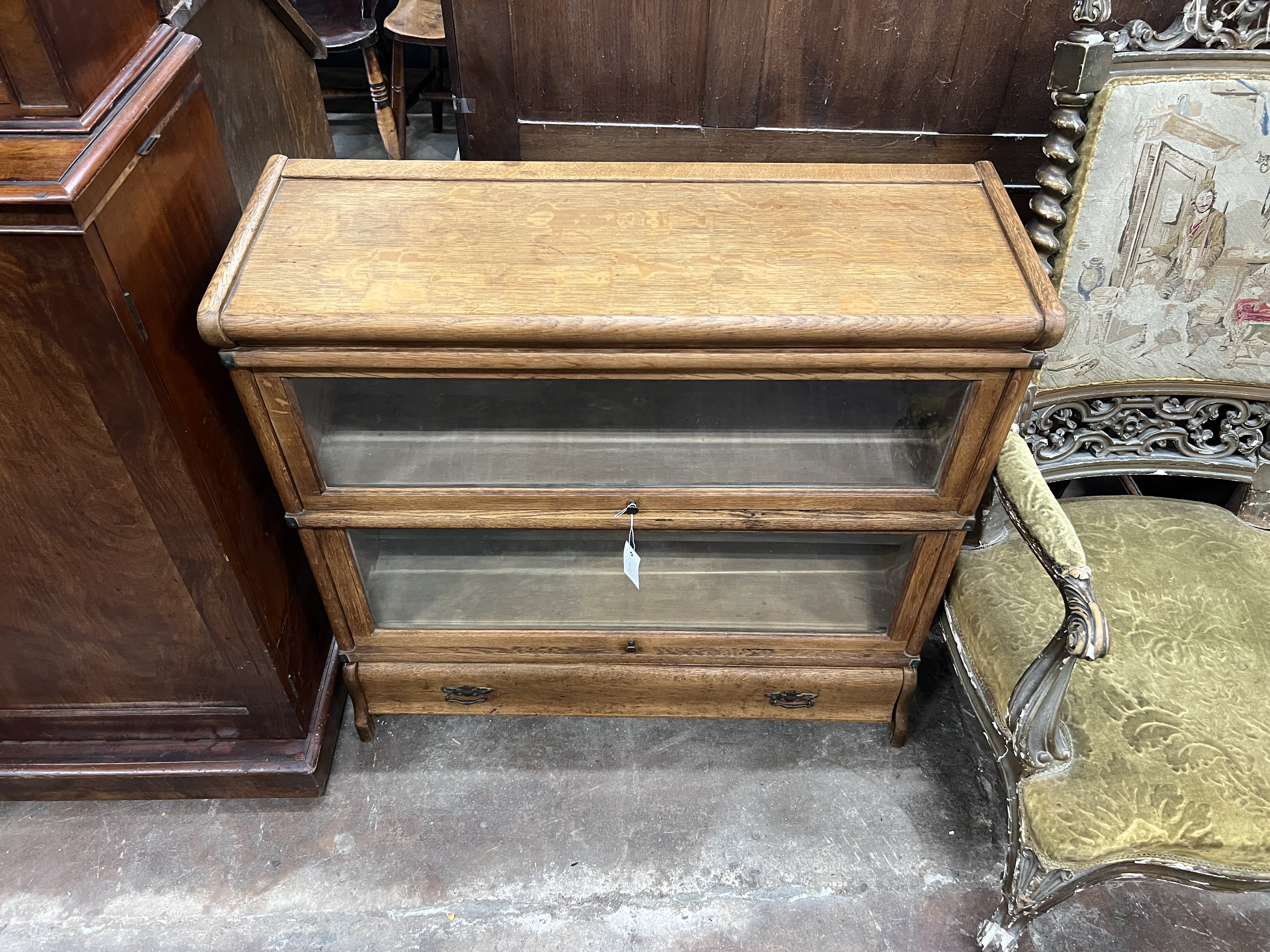 A Globe Wernicke oak two section bookcase with drawer, width 87cm, depth 30cm, height 84cm